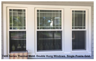 Vinyl replacement window with prairie grids